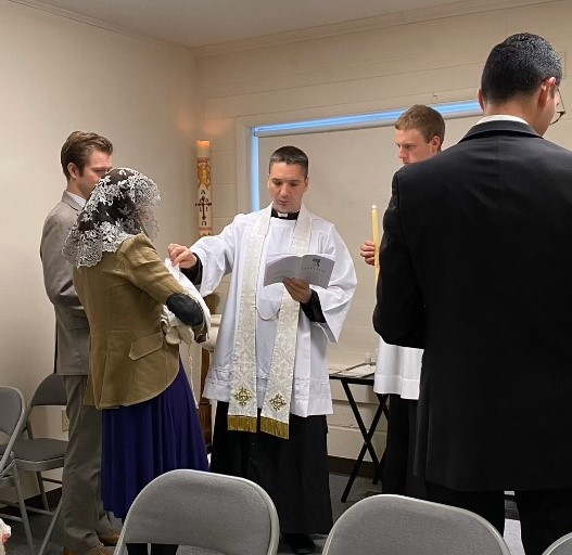 Fr. Haynos Performing a Child Baptism